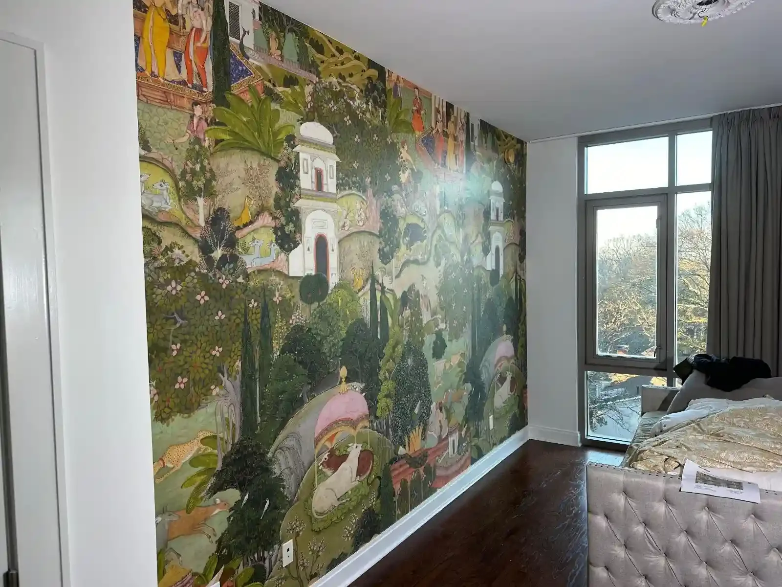 A decorative botanical mural creating a focal wall in a bright interior