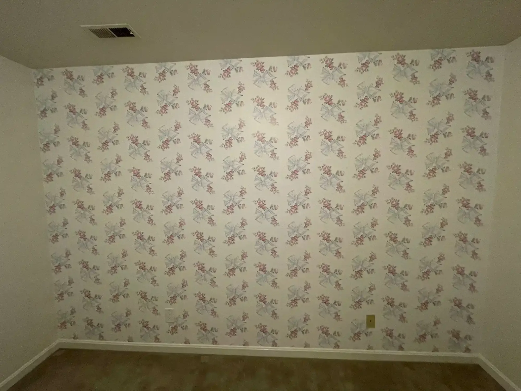 A repeating wallpaper pattern shown across a full wall